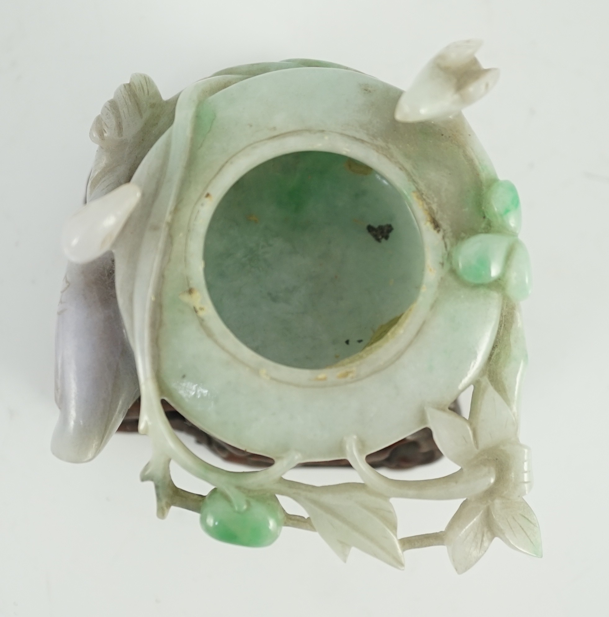 A Chinese lavender and green jadeite water pot and stand, late 19th century, 9.3cm at widest point, wood stand